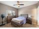 Cozy bedroom with a wooden bed frame and ample storage at 15325 W Port Au Prince Ln, Surprise, AZ 85379