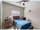 Small bedroom with a twin-size bed and desk at 15325 W Port Au Prince Ln, Surprise, AZ 85379