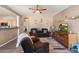 Open concept living room with a view of the kitchen and dining area at 15325 W Port Au Prince Ln, Surprise, AZ 85379