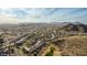 Aerial view of a residential community nestled in a mountainous region at 157 W Latigo Cir, San Tan Valley, AZ 85143