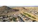 Aerial perspective showcasing homes and a golf course near mountains at 157 W Latigo Cir, San Tan Valley, AZ 85143