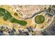 Aerial view of a golf course with sand traps and a pond at 157 W Latigo Cir, San Tan Valley, AZ 85143