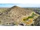 Aerial view of a golf course community with desert landscape and mountain views at 157 W Latigo Cir, San Tan Valley, AZ 85143