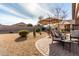 Landscaped backyard with patio and seating area at 157 W Latigo Cir, San Tan Valley, AZ 85143