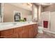 Bathroom features double sinks, wood cabinets, and a large walk-in shower at 157 W Latigo Cir, San Tan Valley, AZ 85143