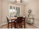 Breakfast nook with four brown chairs and a wood table at 157 W Latigo Cir, San Tan Valley, AZ 85143