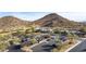 Aerial view of community clubhouse with parking and desert landscape at 157 W Latigo Cir, San Tan Valley, AZ 85143