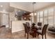 Dining area with a kitchen view, and four leather chairs at 157 W Latigo Cir, San Tan Valley, AZ 85143