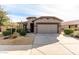 One-story house with desert landscaping and two-car garage at 157 W Latigo Cir, San Tan Valley, AZ 85143