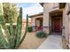 Front entry with red door and pathway, plus desert landscaping at 157 W Latigo Cir, San Tan Valley, AZ 85143