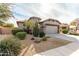 House exterior showcasing desert landscaping and a two-car garage at 157 W Latigo Cir, San Tan Valley, AZ 85143