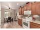 Kitchen features wood cabinets, tile backsplash, and stainless steel appliances at 157 W Latigo Cir, San Tan Valley, AZ 85143