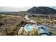 Aerial view of community pool and clubhouse in desert setting at 157 W Latigo Cir, San Tan Valley, AZ 85143