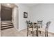 Small dining area with glass table and four chairs at 1603 E Zion Way, Chandler, AZ 85249