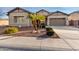 Single-story home with a two-car garage and desert landscaping at 1603 E Zion Way, Chandler, AZ 85249