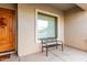 Front porch with a wooden door and a welcoming bench at 1603 E Zion Way, Chandler, AZ 85249