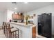 Well-equipped kitchen with breakfast bar and a refrigerator at 1603 E Zion Way, Chandler, AZ 85249