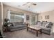 Comfortable living room featuring a grey sofa and a large window at 1603 E Zion Way, Chandler, AZ 85249