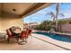 Relaxing covered patio with pool and BBQ grill at 1603 E Zion Way, Chandler, AZ 85249