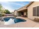 Inviting kidney-shaped pool with a covered patio and seating at 1603 E Zion Way, Chandler, AZ 85249