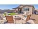 Backyard with fire pit, seating area, and artificial turf at 16789 S 181St Ln, Goodyear, AZ 85338