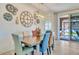 Dining room with large table and chairs near sliding glass doors at 16789 S 181St Ln, Goodyear, AZ 85338