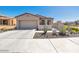 House exterior showcasing a garage and drought-tolerant landscaping at 16789 S 181St Ln, Goodyear, AZ 85338