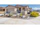 Single-story home with desert landscaping and a two-car garage at 16789 S 181St Ln, Goodyear, AZ 85338