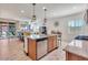 Open concept kitchen with island and stainless steel appliances at 16789 S 181St Ln, Goodyear, AZ 85338