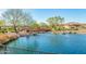 Peaceful lake with a charming wooden bridge at 16789 S 181St Ln, Goodyear, AZ 85338