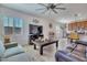 Living room with fireplace and view into kitchen at 16789 S 181St Ln, Goodyear, AZ 85338