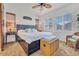 Spacious main bedroom with a comfy bed and sliding barn door at 16789 S 181St Ln, Goodyear, AZ 85338