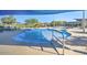 Community pool with a spa and shade umbrellas at 16789 S 181St Ln, Goodyear, AZ 85338