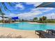 Large community pool with shade structures and lounge chairs at 16789 S 181St Ln, Goodyear, AZ 85338