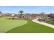 Landscaped putting green with a relaxing walkway at 16789 S 181St Ln, Goodyear, AZ 85338