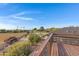 Aerial view showcasing expansive property with a large yard and distant mountain views at 17642 E Hunt Hwy, Queen Creek, AZ 85142