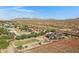 Aerial view of property and desert landscape at 17642 E Hunt Hwy, Queen Creek, AZ 85142