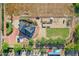 Aerial view showcasing the house, expansive grounds, and surrounding landscape at 17642 E Hunt Hwy, Queen Creek, AZ 85142