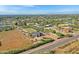 Aerial view of house, land, and neighborhood at 17642 E Hunt Hwy, Queen Creek, AZ 85142