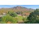 Aerial view of house, expansive lot, and mountain views at 17642 E Hunt Hwy, Queen Creek, AZ 85142