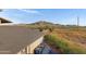 Backyard view featuring mountain landscape and a partially visible home at 17642 E Hunt Hwy, Queen Creek, AZ 85142