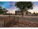 Spacious backyard with a gazebo, fire pit, and bridge at 17642 E Hunt Hwy, Queen Creek, AZ 85142