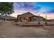 Backyard patio with fire pit, seating area, and mountain views at 17642 E Hunt Hwy, Queen Creek, AZ 85142