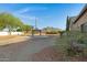 Landscaped backyard with basketball court and mountain views at 17642 E Hunt Hwy, Queen Creek, AZ 85142