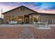 Backyard patio with seating area and access to the house at 17642 E Hunt Hwy, Queen Creek, AZ 85142