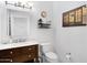 Bathroom with marble vanity and toilet at 17642 E Hunt Hwy, Queen Creek, AZ 85142