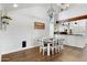 Spacious dining area with hardwood floors and a modern chandelier at 17642 E Hunt Hwy, Queen Creek, AZ 85142