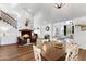 Bright dining room features a rustic wooden table and hardwood floors at 17642 E Hunt Hwy, Queen Creek, AZ 85142