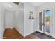 Bright entryway with hardwood floors and back door view at 17642 E Hunt Hwy, Queen Creek, AZ 85142