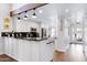 Modern kitchen with white cabinets, granite counters, and stainless steel appliances at 17642 E Hunt Hwy, Queen Creek, AZ 85142